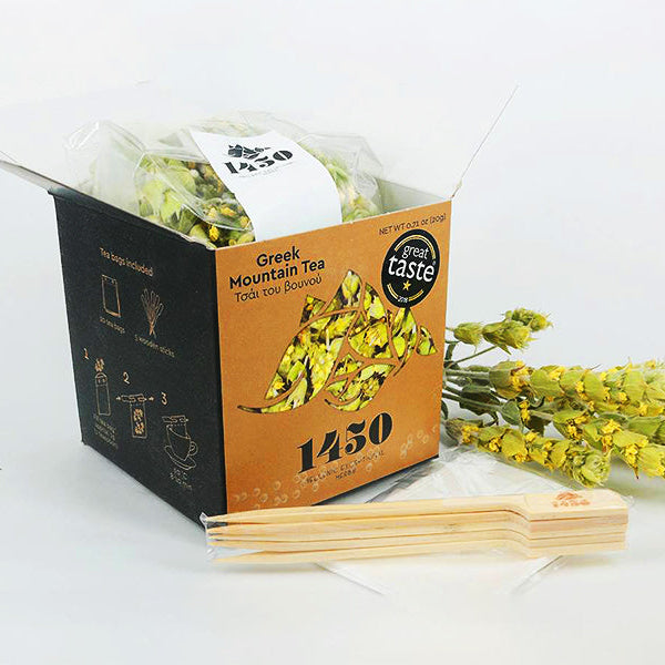 Box of Greek Mountain Tea with tea bags and a sprig of Sideritis Raeseri on a white background